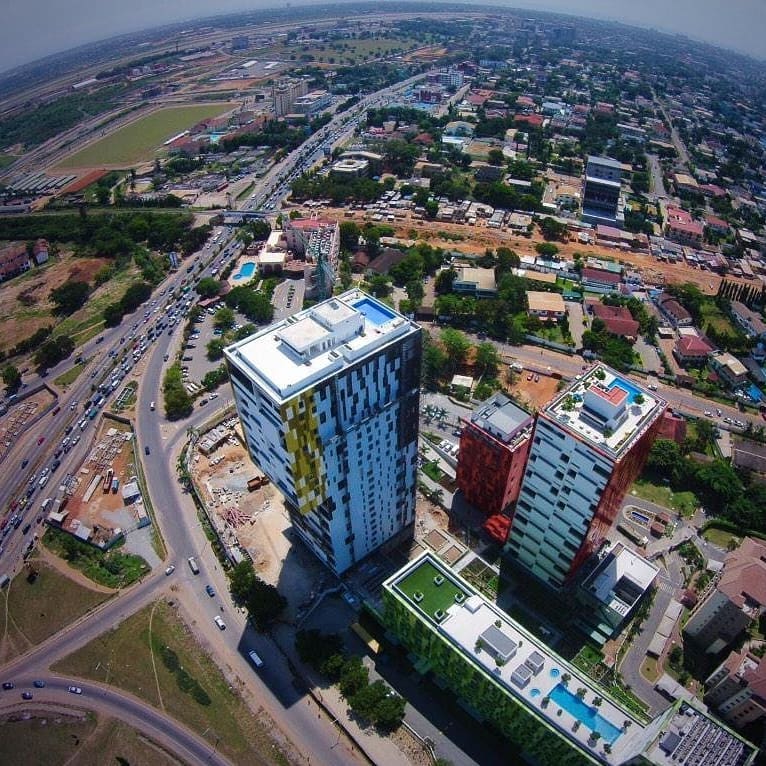 Aerial view of completed Villagio Vistas against background of Accra city (@worldsfinestdestinations_ on instagram)
