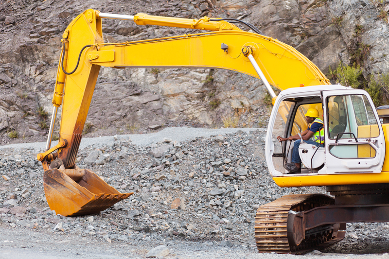 Excavator operator on a road construction project in Africa (Hongki Zhang | Dreamstime)